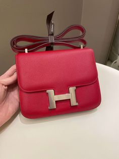 Hermes Constance 18Rouge Casaque Epsom PHWSize 18 x 14 x 5cmQ Square Stamp9-9.5/10 Excellent (minimal faint leather scratches and underflap hardware signs otherwise excellent)Includes dust bagPrice was 12,200 sgdPrice now 11,700 sgd 8880 usd CN5842-04 Hermes Constance, Chic Me, Exclusive Bag, Beautiful Packaging, Bags Designer, Dust Bag, Closet, Quick Saves