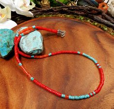 This artisan necklace was lovingly handcrafted with: natural blue4mm heishi Turquoise Beads and 4mm red coral with agate in orange. Turquoise has long been prized for its inspirational influence, bringing feelings of peace, ease and satisfaction to the wearer. Turquoise will help in social situations, making you feel more confidant.  Red coral is considered a powerful tool for meditation and spiritual growth. It is believed to align one's chakras, enhance intuition, and promote a deeper connection with one's inner self.  Wearing red coral gemstone brings numerous benefits: Boosts self-confidence, promotes harmony in relationships, stimulates creativity, and improves  This beautiful coral and turquoise necklace is 22 inches long. This necklace is made on 49 strand professional beading wire Healing Rocks, Orange Turquoise, Sacred Stones, Artisan Necklace, Coral Gemstone, Necklace Red, Summer Necklace, Fragrance Spray, Moon Jewelry