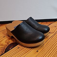 Brand New, Never Worn, And Come With Original Box. These Are A Black Faux Leather With Faux Wood Bottom. Women's Size 7. Black Comfortable Clogs With Leather Sole, Comfortable Black Clogs With Leather Sole, Black Mules With Cushioned Footbed, Medium Width, Black Leather Footbed Clogs With Round Toe, Comfortable Black Clogs With Round Toe, Black Clogs With Wooden Heel And Medium Width, Comfortable Black Round Toe Clogs, Casual Black Mules With Wooden Heel, Casual Black Mules Medium Width