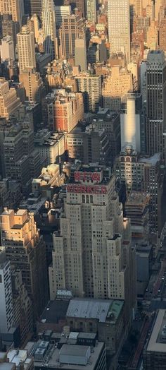 an aerial view of city buildings and skyscrapers