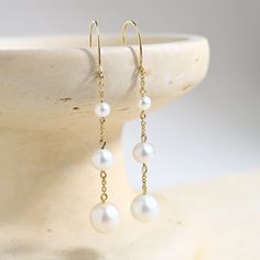 Prized for their beauty and elegance, these pearl chain earrings are a sophisticated addition to your wardrobe. With a subtle movement, these pearls are fit for any bridal or everyday sophisticated look. Affordable Pearl Chain Drop Earrings, Classic Teardrop Pearl Chain Earrings, Elegant Teardrop Pearl Chain Earrings, Delicate Linear Pearl Chain Drop Earrings, Formal 14k Gold-filled Pearl Chain Earrings, Latina Jewelry, Detailed Jewelry, White Freshwater Pearl, Perfume Spray