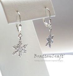 These sterling silver snowflake earrings are very pretty! The detailed snowflake charm is sterling silver and measures (without the attached ring) 14.5mm or .57 inches in diameter. The leverback is sterling silver with a tear drop accent. These lovely earrings are ready to ship and will arrive in a gift box. Check out the matching Snowflake Necklace and other snowflake jewelry here: https://www.etsy.com/shop/BrattonCraft?ref=listing-shop2-all-items-count&search_query=snowflake Check out othe Sterling Silver Snowflake Jewelry For Winter, Silver Snowflake Jewelry For Holidays, Holiday Silver Snowflake Jewelry, Winter Gift Drop Earrings, Silver Snowflake Jewelry For Christmas, Holiday Sterling Silver Jewelry, Nickel-free Sterling Silver Christmas Earrings, Nickel-free Sterling Silver Earrings For Christmas, Nickel-free Silver Earrings For Christmas