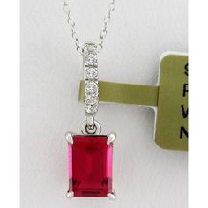 Karat: .925 Sterling Silver Gemstones: 1 Created Ruby - 1.05 Carats Ruby Grades, Hue . . . Red Tone . . . Medium Saturation . . . Vivid Cut . . . Excellent No Inclusions Or Flaws 6 Created White Sapphires - 0.01 Ct Each Net Weight: 1.5 Grams Shape: Emerald Cut & Round Setting: Prong & Shared Prong Dimensions : 7 Mm X 5 Mm - Main Gemstone Measurements 18 Mm (0.70") - Bail Included X 5 Mm (0.19") // Chain 18" Long Chain Is A Complimentary Gift Made Of Silver - 18" Long Appraisal Available For A Lo Dazzling Gia-certified Ruby Jewelry, Dazzling Gia Certified Ruby Jewelry, Classic Necklace With Lab-created Ruby, Red Brilliant Cut Gemstones For Anniversary, Red Sterling Silver Jewelry With Brilliant Cut, Red Brilliant Cut Sterling Silver Jewelry, Red Brilliant Cut Gemstone For Gift, Gia Certified White Gold Jewelry For Valentine's Day, Red Emerald-cut Sterling Silver Jewelry