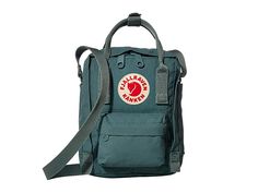 Fjallraven Kanken Sling - Cross Body Handbags : Frost Green : Grab a few quick essentials with the Kånken Sling. Small main compartment hidden zip compartment to hold all your daily essentials. Front zip pocket for additional storage. Dual top handles with snap closure for toting. Adjustable single shoulder strap for a comfortable fit. Fjällräven logo patch on front. Volume: 2.5 L. Materials: 100% Vinylon-F. Imported. Measurements: Bottom Width: 6 in Depth: 3 in Extended Depth: 8 in Strap Length Green Logo Crossbody Shoulder Bag, Green Crossbody Bag With Logo, Green Logo Crossbody Bag, Green Shoulder Bag With Logo For Daily Use, Functional Everyday Shoulder Bag With Logo, Casual Backpack With Logo For Daily Use, Green Casual Crossbody Backpack, Casual Logo Backpack For Everyday Use, Casual Everyday Backpack With Logo