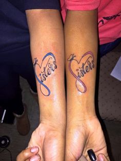 two people with matching tattoos on their arms, one has the word sister and the other says sister