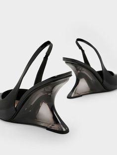 A modern twist on a classic, these slingback pumps come with stunning sculptural heels that will turn heads wherever you go. To top it off, these wedge heels have an eye-catching see-through design. The pointed-toed silhouette keeps these shoes looking sleek and polished, while the black patent finish exude a glossy shine. Wear them with a classy shirt dress for an effortlessly chic desk-to-dinner look. Classy Shirt Dress, Heal Shoe, Dress Down Day, Plastic Items, Size Chart For Kids, Faux Leather Heels, Charles Keith, Black Wedges, Slingback Pump