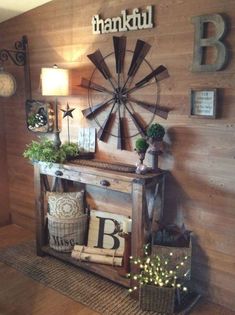 a living room with wood paneled walls and decorative items on the wall, including a windmill