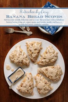 a white plate topped with scones covered in frosting