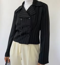 "Vintage striped cropped double breasted blazer with oversized collars. In great condition, minimal wear. Measurements: Size: 6 Shoulder to shoulder: 17.5\" Length: 18\" Sleeve: 22\" Material: 100% Polyester Vintage and pre-loved items are one of a kind and may have minor imperfections. The color of the item may slightly vary due to lighting. The model in the photo wears a size XS/S and is 5'3\". We cannot be certain that an item will fit you. Please refer to the measurements. All Sales Final" Fall Striped Double-breasted Blazer, Striped Double-breasted Long Sleeve Blazer, Retro Striped Outerwear For Work, Striped Retro Outerwear For Work, Fall Striped Blazer With Double Button Closure, Double-breasted Striped Outerwear For Office, Striped Double-breasted Outerwear For Office, Vintage Striped Workwear Blazer, Vintage Striped Blazer For Work