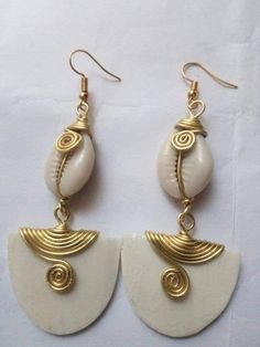 The earrings are made from brass, cowries and bone with a lot of love and care. The are light in weight and comfortable to wear. Buy more than one pair of earrings and pay shipping for one. For more earrings, follow the link. https://www.etsy.com/listing/710219155/african-earringslong-beaded-earrings?ref=shop_home_active_2 **Happy shopping** Dhl shipping express Thank you. Afro Jewelry, African Earrings, Women Earrings, Jewelry Lookbook, African Jewelry, Brass Earrings, African Women, Earring Gifts, Wire Jewelry