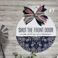 a sign that says shut the front door