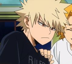 two anime characters one with blonde hair and the other with blue eyes looking at something