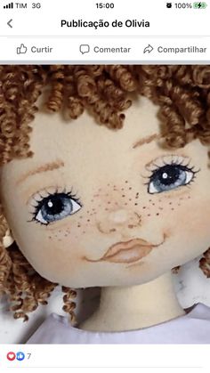 a doll with curly hair and blue eyes