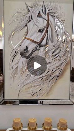 a painting of a white horse on display in front of some jars with gold lids