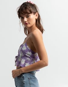 Full Tilt Floral Split Button Front Womens Cami. All Over Floral Print. Button Front. Lined Bust. Adjustable Straps. Cropped Fit. Elastic Back Seam. Adjustable Ties At Front. 100% Rayon. Hand Wash. Imported. Model Is Wearing A Size Small. Model Measurements:height: 5'8" Bust: 32"waist: 26"hips: 36" Trendy Vacation Tops With Button Closure, Trendy Tops With Button Closure For Vacation, Summer Button-up Crop Top With Button Closure, Summer Button-up Crop Top With Buttons, Summer Buttoned Crop Top, Summer Casual Crop Top With Buttons, Casual Summer Crop Top With Buttons, Purple Button-up Top For Day Out, Casual Crop Top With Button Closure For Summer