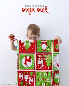 a young boy is holding up a santa sack with the words how to make a santa sack on it