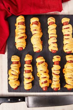 hotdogs wrapped in crescented bread on a baking sheet