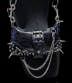 Edgy Black Shoulder Bag With Rivets, Edgy Shoulder Bag With Rivets For Concerts, Black Gothic Shoulder Bag With Rivets, Gothic Black Shoulder Bag With Rivets, Edgy Shoulder Bag With Hardware For Alternative Fashion, Black Punk Evening Bags, Black Punk Style Evening Bags, Punk Style Shoulder Bag With Rivets For Concerts, Punk Leather Party Bag