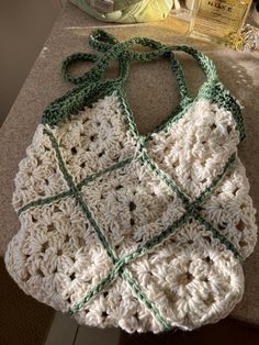 a crocheted purse sitting on top of a counter