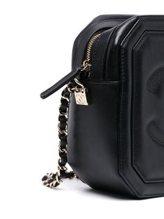 Camera bags are named for their practical, compact shape. Crafted from black lambskin, this Chanel bag from 2021 features the brand's signature CC logo on one side and quilted detailing on the other. Wear it across the body or over your shoulder on busy days using the interwoven chain leather strap. Comes with the original box and dust bag. Minor marks of wear are visible. Prada Jewelry, Prada Crossbody Bag, Cc Logo, Vuitton Bag, Leather Chain, Chanel Bag, Camera Bag, Luxury Bags, Designer Shoes