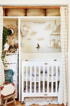 a baby's room with a crib, dresser and bed