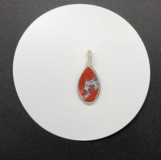 This unique Pendant has a combination of Red Jasper and Druzy Agate in Argentium Silver. Cabochon created by Monkeylion Designs. Approximately 2 1/8" long and 7/8" wide. Argentium silver contains a greater amount of pure silver (935 which contains 93.5% pure silver with the remainder being made up of other alloys, such as a small amount of germanium). This makes it more tarnish resistant than Sterling (.925) Silver. Crystal Formations, Argentium Silver, Druzy Agate, Red Jasper, Unique Pendant, Agate Pendant, Sparkling Crystal, Modern Elegance, Touch Of Modern