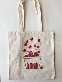 a tote bag with cherries on it