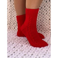 These Christmas red socks are so comfortable you'll want to wear them all year long. Our hand knit cozy socks provide a higher quality of craftsmanship, which means you can enjoy them year round, year after year.  Never again will you leave the comfort of your warm bed to be awoken by an ice cold floor beneath your feet.    These cable knit socks are stylish and sleek.  They are knitted from chunky wool and acrylic yarn. Socks are available from size 2UK/4 US up to 13UK/15US. See the sizing char Red Socks As Winter Gifts, Red Winter Socks As Gift, Casual Knitted Socks For Gifts, Casual Warm Socks For Gift, Casual Warm Socks For Gifts, Casual Warm Socks Gift, Knitted Socks For Winter Gifts, Red Socks For Winter Gift, Comfortable Knit Socks As Gift