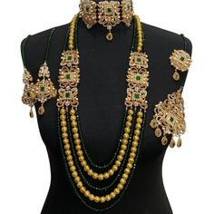 bridal jewellery set. Set includes- Necklace  Mala Earrings  Jhumar  Tikka Bollywood Green Bridal Earrings For Reception, Green Lehenga With Stone Work For Reception, Green Bollywood Bridal Sets For Reception, Green Bridal Sets For Diwali Reception, Green Bridal Earrings For Wedding, Festive Green Bridal Earrings For Wedding, Diwali Reception Green Bridal Sets, Green Kundan Jewelry For Wedding, Green Meenakari Bridal Earrings For Wedding