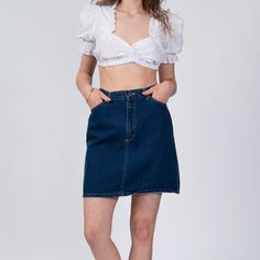 Vintage 90s high waisted dark wash denim mini skirt by Lee Riders.  Measurements and Item Details: Fits like: Labeled size 11, fits modern women's medium (27.5" waist) Fabric: Cotton denim Brand: Lee, made in USA Condition: Excellent Length: 18" Waist: 27.5" Hips: 39" - taken at the bottom of zipper opening Shown on a 5'8" model with measurements of 34"-26"-37", usually wears a size small. See our FAQ section for more information on sizing and condition ratings. Fitted High Rise Dark Wash Skort, Retro Denim Mini Skirt, 90s Style Denim Mini Skirt For Summer, 90s Denim Mini Skirt For Summer, 90s Style Fitted Denim Skirt In Medium Wash, Retro Fitted Dark Wash Denim Skirt, 90s Style Fitted Medium Wash Denim Skirt, Fitted Retro Denim Skirt In Dark Wash, Fitted Retro Dark Wash Denim Skirt