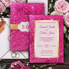 pink and gold glitter wedding stationery set with matching envelopes, rings, and flowers