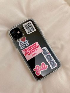 an iphone case with stickers on it