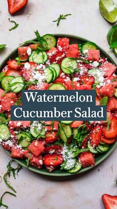 a bowl filled with cucumber, strawberry and mint salad