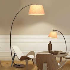 a lamp that is sitting on top of a table next to some chairs and tables