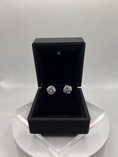 Introducing these breathtaking diamond studs set on 14Kt gold earrings.  Each is 2 carrots, for a total of 4 carrots. All orders come with screwbacks and a free battery-lit earring box similar to the ones photographed. Some of the Diamonds photographed are 2 Ct diamonds and some are 3 Ct diamonds. Actual size may vary. The Diamonds  Diamonds: 2 Lab Grown Diamond Weight: 2 Ct Each, Totalling 4 Ct Cut: Round Color: F+ Clarity: SI1+ Certificate: GIA/IGI The Settings  3 Prong Martini 14 Ct Gold in y Earrings Diamond Studs, Round Diamond Earrings, Studs Gold, Earring Box, First Photograph, Gold Diamond Earrings, Free Earrings, Stud Set, 14kt Gold