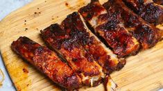 some ribs are cut up on a cutting board