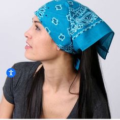 a woman wearing a blue bandana looking off to the side