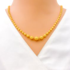 This exquisite 22k gold Lara necklace set, weighing 28.4 grams, features a radiant yellow gold finish and a striking striped design. The necklace measures 20 inches in length, with adjustable 0.6-inch links for a perfect fit. The set includes matching earrings, each 1.5 inches long with screw back posts and detachable hanging elements. Secured with a hook lock, this set is ideal for those who appreciate elegant and sophisticated jewelry, combining timeless beauty with a bold striped motif, making it perfect for any special occasion or stylish everyday wear. PRODUCT DETAILS Gold Purity(karat): 22k Gold Weight(grams): 28.4 Item Finish: Yellow Gold Necklace Length: 20" Adjustable Links: 0.6" Links Lock Style: Hook Lock Matching Earrings: Included Earring Length: 1.5" Earring Post: Screw Back Yellow 22k Gold Round Necklace, Yellow Round Temple Jewelry Necklace, Formal Yellow 22k Gold Chain Necklace, Elegant Yellow Gold Chain Necklace For Festivals, Festive Yellow Gold-plated Necklaces, Yellow Necklace For Formal Festive Occasions, Yellow Necklace For Festive Formal Occasions, Yellow Formal Necklace For Festive Occasions, Festive Yellow Necklace For Formal Occasions