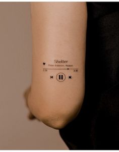 a woman's arm with an audio player tattoo on the left side of her arm