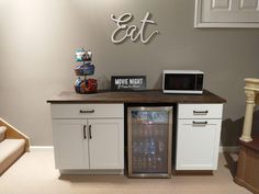 a microwave and refrigerator in a small room