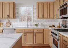 a kitchen with wooden cabinets and white marble counter tops, along with stainless steel appliances