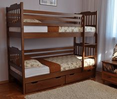 a bunk bed with two sets of drawers underneath it in a room next to a window