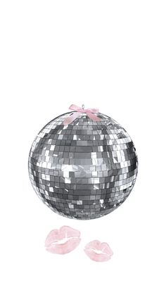 a silver disco ball with pink bows on it and two kisses coming out of it