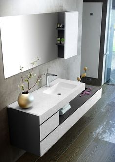 a bathroom with a sink, mirror and shelves on the wall next to wood flooring