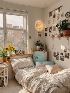 an unmade bed sitting next to a window in a bedroom