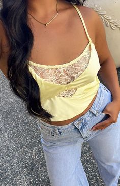 Satin Yellow Lace Crop Top

How to style:
Stunning new summer top ALERT!!! This top is the perfect breathable crop top () to rock during summer () with lace detailing and cut outs to elevate any outfit. Pair this top with a long white maxi skirt () and sneakers for every day wear or add some heels to be fit to grab cocktails with the gals. Finalising this fit with gold jewellery () will tie this outfit all together

Features: 
  
 * Light weight satin material 
 * Slight stretch 
 * Lined 
 * Lace centre bust detailing 
 * Thin elastic back band 
 *  Thin adjustable straps
  
 * Left invisible zip 
 * Slightly cropped length 
 * Scoop neckline Maxi Skirt And Sneakers, Cropped Aesthetic, White Maxi Skirt, White Maxi Skirts, Satin Crop Top, Yellow Satin, Summer Yellow, Skirt And Sneakers, Be Fit