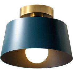 a blue and gold light fixture on a white background