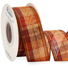 a roll of orange and red plaid ribbon