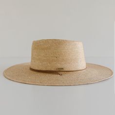 DESCRIPTION Crafted with exotic Guatemalan Palm Straw and hand shaped in Texas, USA, the Monterrico is a sturdy, toasted colored straw hat shaped into a teardrop fedora crown and wide, flat brim that offers amazing sun protection. Trimmed with a brown, genuine leather chinstrap and leather slider, the Monterrico is the perfect summer companion, and is built to stick with you for years to come. UPF Rating: 50 + (Excellent) HAT SIZE CHART Available in 55 S, 57 M, 59 L, 61 XL and 63 XXL. Due to the Adjustable Natural Color Fedora With Flat Crown, Natural Fedora With Adjustable Flat Crown, Adjustable Natural Fedora With Flat Crown, Summer Fedora With Adjustable Flat Crown, Artisan Brimmed Boater Hat For Summer, Spring Fedora With Flat Crown In Natural Color, Summer Fedora With Flat Crown And Toquilla Straw, Natural Fedora With Flat Crown For Spring, Summer Fedora With Flat Crown In Natural Color