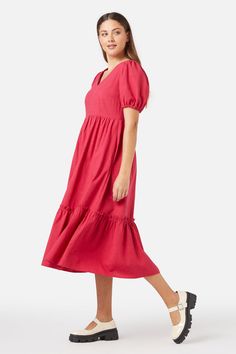 Berry red midi smock dress, with a sweet v neckline. Featuring a deep hem ruffle, short puff sleeves & made of a cotton viscose blend.- slip on this easy relaxed style smock- soft v neckline with a sweet puff sleeve- midi length featuring a hem tier with exposed ruffle- handy side pocket- elastic hem on sleeve- side ties to cinch in at waist- made of a smooth viscose cotton blend- available in cornflower Product Code: PGFY142 Midi Smock Dress, Red Midi, Cotton Viscose, Dress 16, Smock Dress, Relaxed Style, Side Pocket, Puff Sleeves, Midi Length